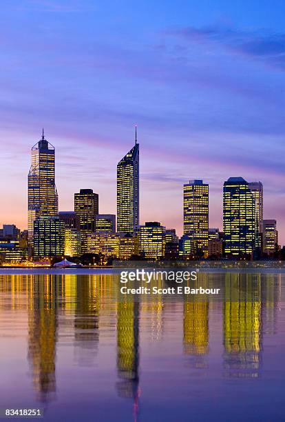 city skyline at dusk across the swan river - perth skyline stock pictures, royalty-free photos & images