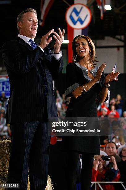 Denver Broncos former quarterback John Elway and his fiancee Paige Green listen to Republican presidential nominee Sen. John McCain during a campaign...