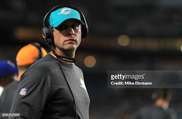 Head coach Adam Gase of the Miami Dolphins looks on during a preseason game against the Baltimore Ravens at Hard Rock Stadium on August 17, 2017 in...