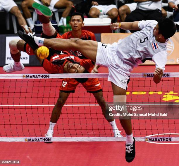 Thailand player Kritsanapong Nontakote plays a shoot in the Sepak Takraw Men's team competition against Thailandi on day one of the 2017 SEA Games on...