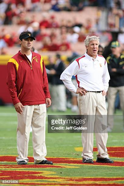 Offensive Coordinator Steve Sarkisian and head coach Pete Carroll of the USC Trojans look on before the game against the Oregon Ducks on October 4,...