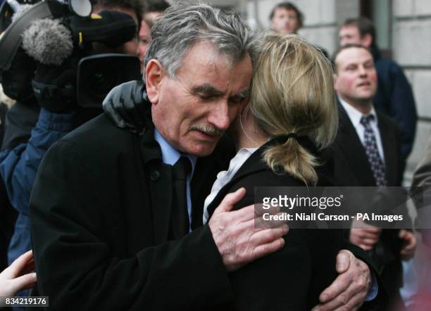 Owen McLaughlin father of Siobhan Kearney who was murdered by her husband Brian Kearney, hugs his daughter Caroline after hearing Kearney receive a...
