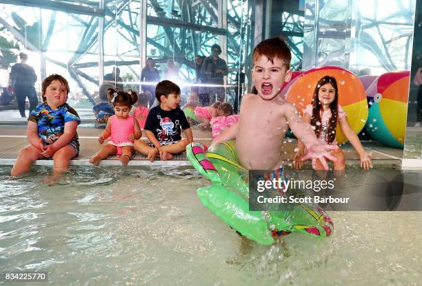Children play in a 11 metre long swimming pool to celebrate the Australian premiere of The Pool exhibition at the National Gallery of Victoria...