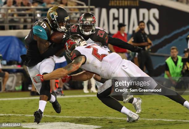 Allen Robinson of the Jacksonville Jaguars attempts a reception against Chris Conte of the Tampa Bay Buccaneers during a preseason game at EverBank...