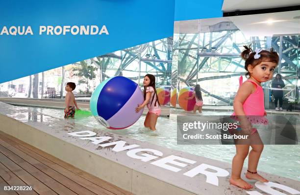 Children play in a 11 metre long swimming pool to celebrate the Australian premiere of The Pool exhibition at the National Gallery of Victoria...