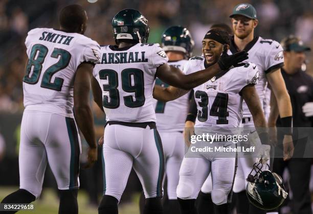 Byron Marshall of the Philadelphia Eagles celebrates with Torrey Smith, Donnel Pumphrey, and Carson Wentz after scoring a touchdown in the fourth...