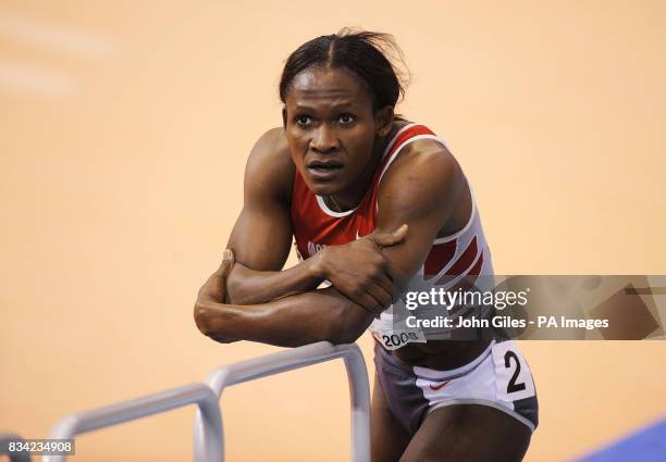 Maria Mutola appears dejected after she finished in third place in the Finals of the Womens 8800m Event during the IAAF World Indoor Championships at...