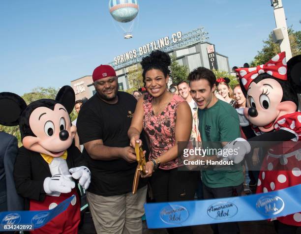 In this handout photo provided by Disney Resorts, "American Idol" winners Ruben Studdard, Jordin Sparks and Kris Allen cut the celebratory ribbon,...