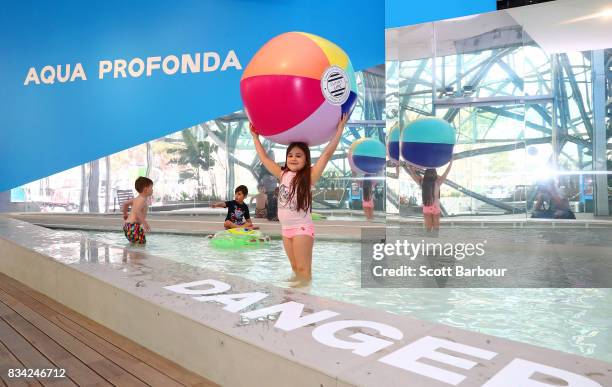 Children play in a 11 metre long swimming pool to celebrate the Australian premiere of The Pool exhibition at the National Gallery of Victoria...