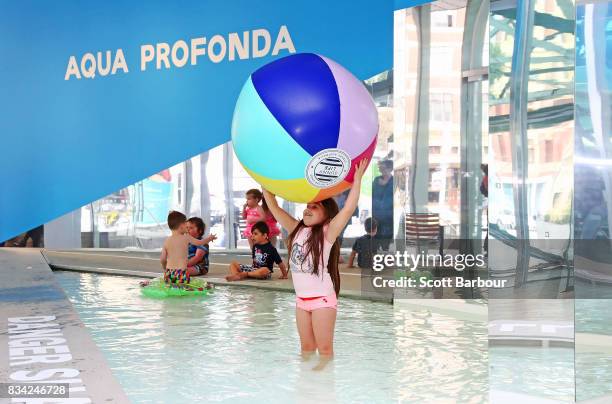 Children play in a 11 metre long swimming pool to celebrate the Australian premiere of The Pool exhibition at the National Gallery of Victoria...