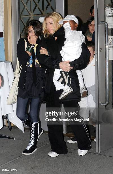 Madonna leaves a Kabbalah center with her daughter Lourdes Leon and her son David Banda on October 24, 2008 in New York City.