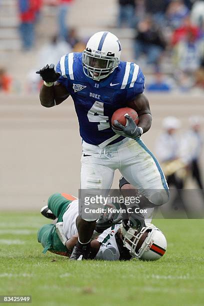 Clifford Harris of the Duke Blue Devils carries the ball against Darryl Sharpton of the Miami Hurricanes at Wallace Wade Stadium on October 18, 2008...