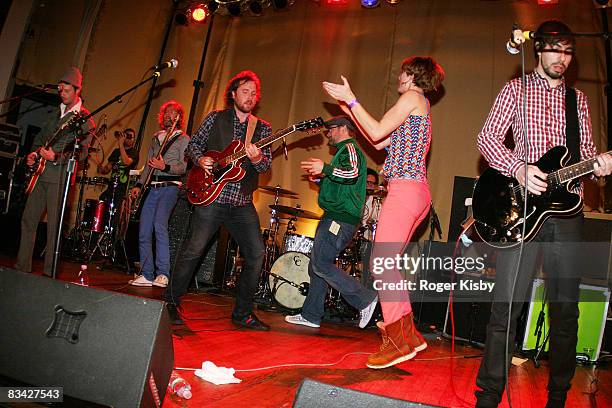 Singer/guitarist Kevin Drew of Broken Social Scene and Elizabeth Powell of Land of Talk perform with Broken Social Scene onstage at the CMJ Music...