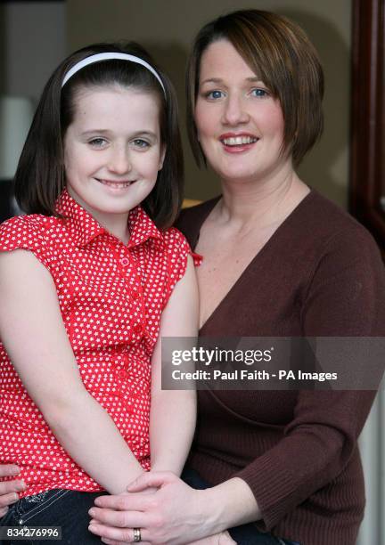 Caroline McArdle with her daughter Erin, in their Ballymena home.