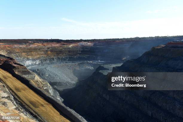 Dust rises the White Foil open mine pit at Evolution Mining Ltd.'s gold operations in Mungari, Australia, on Tuesday, Aug. 8, 2017. Evolution Mining...