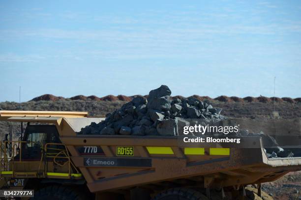 Dump truck laden with ore sits in the White Foil open mine pit at Evolution Mining Ltd.'s gold operations in Mungari, Australia, on Tuesday, Aug. 8,...