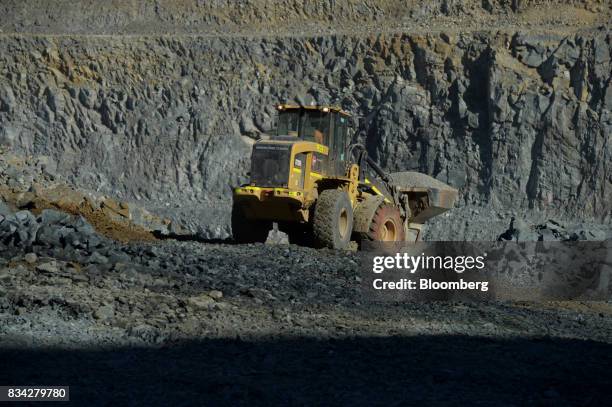 An loader works in the White Foil open mine pit at Evolution Mining Ltd.'s gold operations in Mungari, Australia, on Tuesday, Aug. 8, 2017....