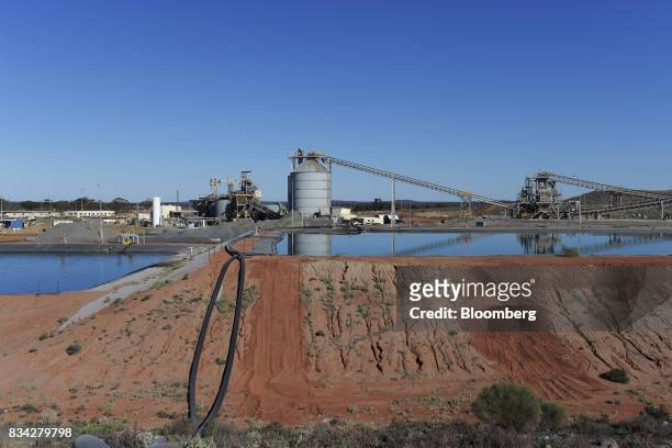 Water reserve pond sits in front of the processing plant at Evolution Mining Ltd.'s gold operations in Mungari, Australia, on Tuesday, Aug. 8, 2017....