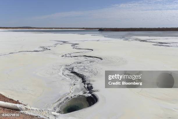 Hardened waste forms cracks and patterns on the surface of the tailings dam at Evolution Mining Ltd.'s gold operations in Mungari, Australia, on...