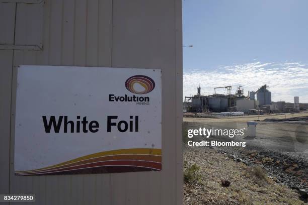 An sign for the White Foil open pit mine is displayed at an administration building of Evolution Mining Ltd.'s gold operations in Mungari, Australia,...