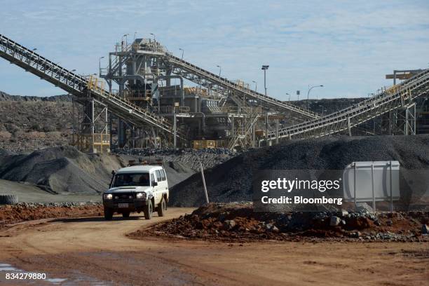 Vehicle drives through the processing plant at Evolution Mining Ltd.'s gold operations in Mungari, Australia, on Tuesday, Aug. 8, 2017. Evolution...