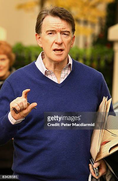 Business Secretary Lord Mandelson gestures to photographers as he walks near his home on October 25, 2008 in London. Lord Mandelson has admitted in a...