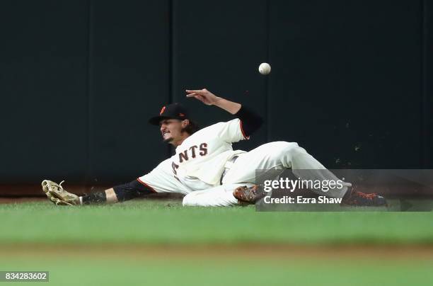 Jarrett Parker of the San Francisco Giants tries unsuccessfully to catch a ball hit by Freddy Galvis of the Philadelphia Phillies in the seventh...
