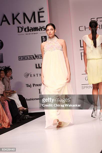 Indian model Indrani Das Gupta showcases a design by Sherina Dalamal's label Cherie D on the catwalk during Lakme Fashion Week 2008 day 5 held at...