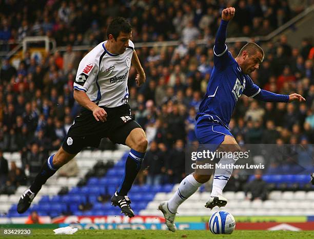 Kevin Phillips of Birmingham beats the challenge from Richard Wood of Sheffield during the Coca-Cola Championship match between Birmingham City and...