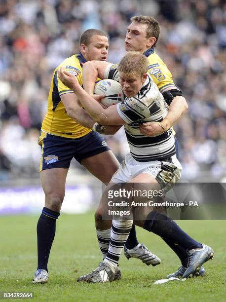 Hull FC's Danny Washbrook is tackled by Leeds Rhinos' Jordan Tansey and Kevin Sinfield during the engage Super League match at the KC Stadium, Hull.