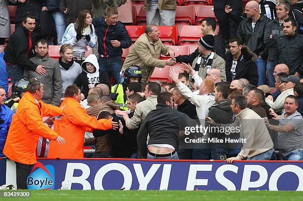Fights break out between rival fans during the Barclays Premier League match between Sunderland and Newcastle United at the Stadium of Light on...