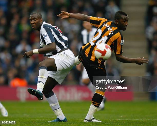 Ishmael Miller of West Bromwich Albion battles for the ball with Kanil Zayette of Hull City during the Barclays Premier League match between West...