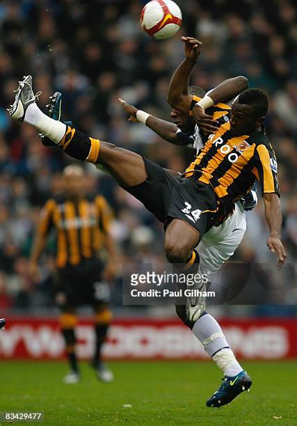 Ishmael Miller of West Bromwich Albion battles for the ball with Kanil Zayette of Hull City during the Barclays Premier League match between West...