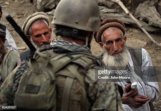 Village elders speak with a U.S. Marine as Afghan and U.S. Forces search for weapons October 25, 2008 in the Korengal Valley of Kunar Province in...