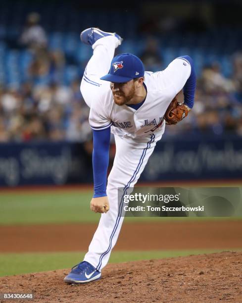 Danny Barnes of the Toronto Blue Jays delivers a pitch in the seventh inning during MLB game action against the Tampa Bay Rays at Rogers Centre on...