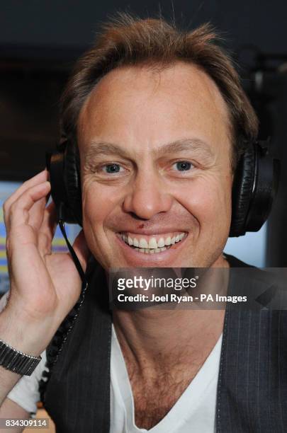 Jason Donovan poses during a photocall at the Capital FM studios in Leicester Square, central London, as he launches his new radio show 'Sunday Night...
