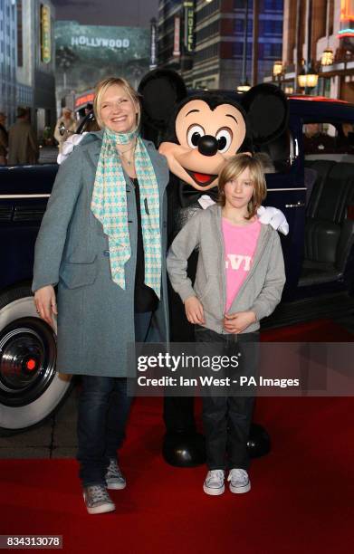 Jo Whiley and her son Jude with Mickey Mouse arriving at the opening of The Twilight Zone of Terror during the 15th Anniversary Celebrations at...