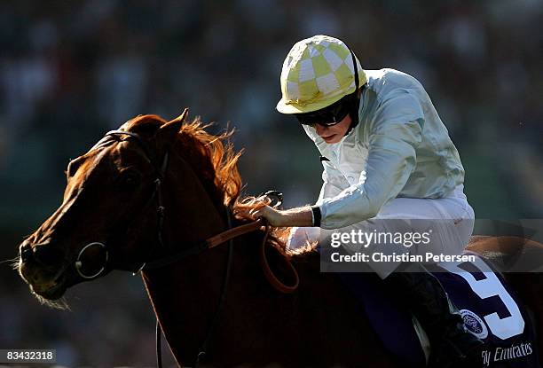 Jockey Ryan Moore rides Conduit en route to winning the Emirates Airlines Breeders' Cup Turf race during the Breeders' Cup World Championships at...
