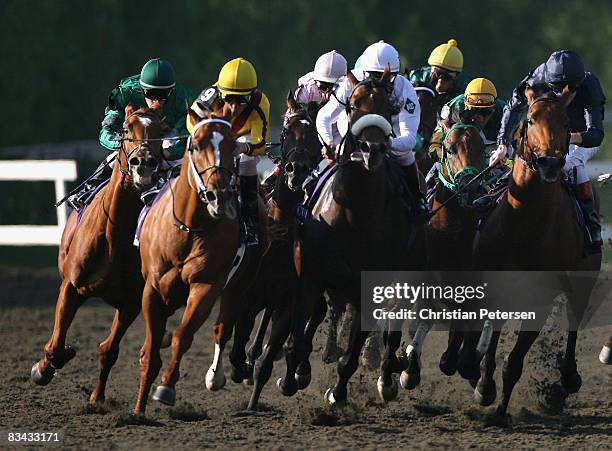 Jockey Frankie Dettori atop Raven's Pass sprints around the outside of Robby Albarado atop Curlin to win the Breeders' Cup Classic during the...