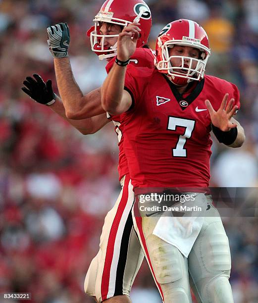 Quarterback Matthew Stafford of Georgia reacts with teammate Kris Durham after he threw a first half touchdown against Louisiana State in their...