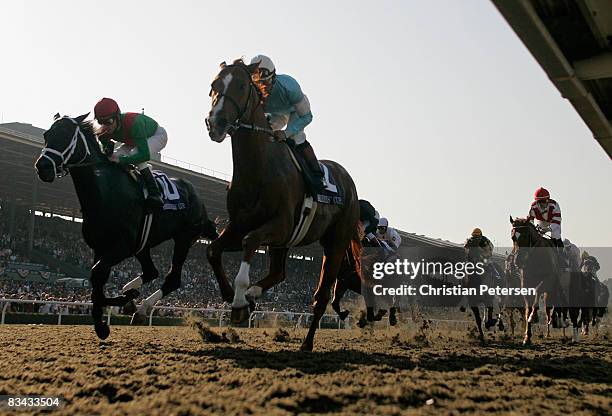 Jockeys Richard Migliore atop Fairbanks and Victor Espinoza atop Casino Drive compete in the Breeders' Cup Classic during the Breeders' Cup World...