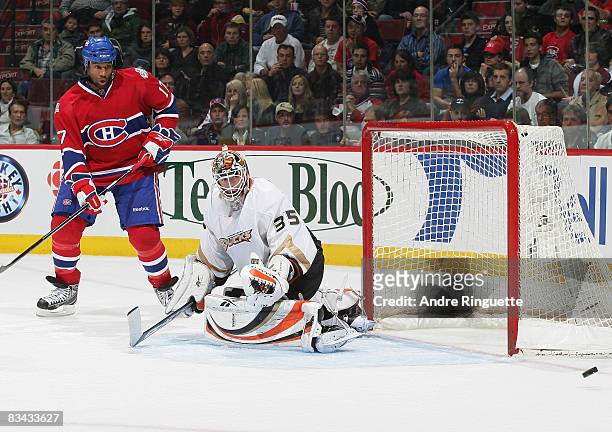 Georges Laraque of the Montreal Canadiens looks on as a rebound goes wide after a save by Jean-Sebastien Giguere of the Anaheim Ducks at the Bell...
