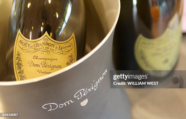 Champagne sits on the counter of Vintage Cellars in the upmarket Melbourne suburb of South Yarra, on October 24 as a plunge in the Australian dollar...