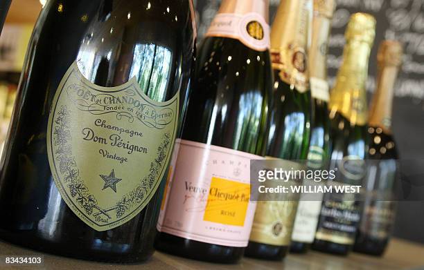 Champagne sits on the counter of Vintage Cellars in the upmarket Melbourne suburb of South Yarra, on October 24 as a plunge in the Australian dollar...