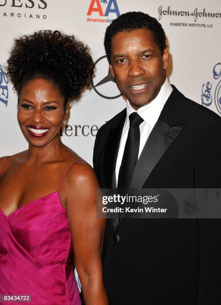 Actor Denzel Washington and his wife Pauletta Washington pose during the cocktail reception at the 30th anniversary Carousel of Hope Ball to benefit...