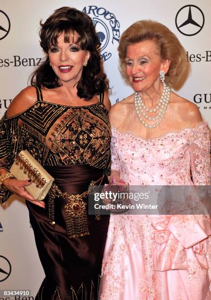 Actress Joan Collins and Barbara Davis pose during the cocktail reception at the 30th anniversary Carousel of Hope Ball to benefit the Barbara Davis...