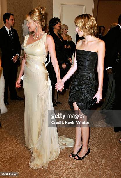 Actress Melanie Griffith and daughter Dakota Johnson pose during the cocktail reception at the 30th anniversary Carousel of Hope Ball to benefit the...