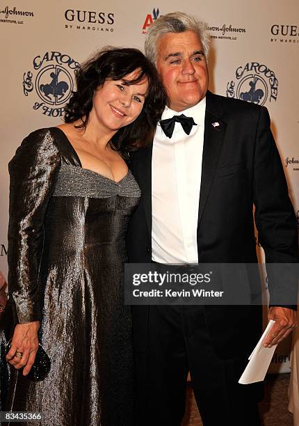 Personality Jay Leno and wife Mavis Nicholson pose during the cocktail reception at the 30th anniversary Carousel of Hope Ball to benefit the Barbara...