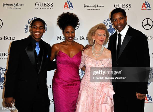 Malcolm Washington, Pauletta Washington, Barbara Davis and actor Denzel Washington pose during the cocktail reception at the 30th anniversary...