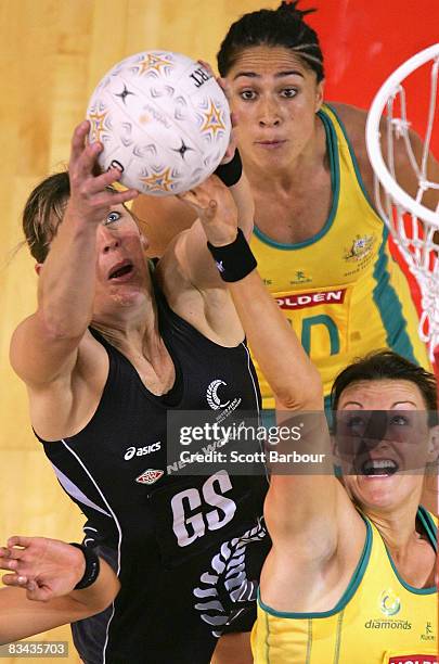 Irene van Dyk of the Silver Ferns and Bianca Chatfield of the Diamonds compete for the ball during game one of the Holden Netball Test Series between...